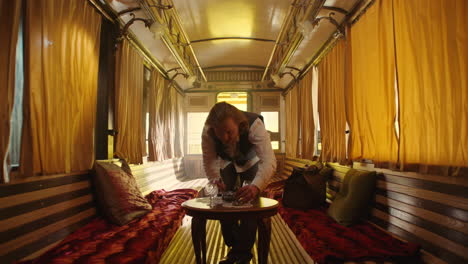 vintage train carriage interior with man