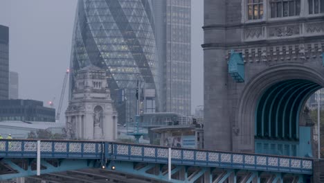 30-St-Mary-Axe,-the-Gherkin,-famous-skyscraper-in-London,-slow-tilt-up-rainy-day