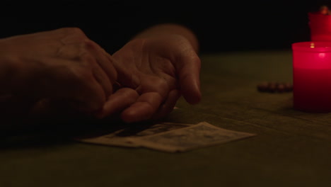 palmistry reading with candles and cards