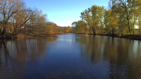 Aerial-flying-close-to-water-up-the-Elkhorn-Creek-in-the-fall