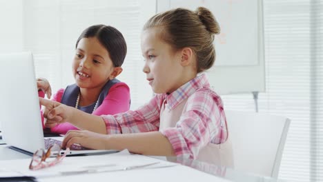 Girls-as-executives-discussing-over-a-laptop-in-the-office-4K-4k