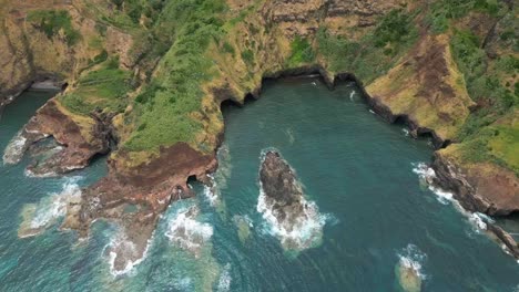 santa maria island's rocky coastline and clear blue waters in azores, aerial view