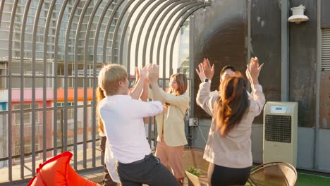 asian business team clapping hands their financial success