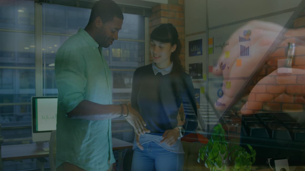 Animation of hands using computer over diverse business people in office
