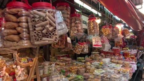 colorful snack stall with various treats and customers