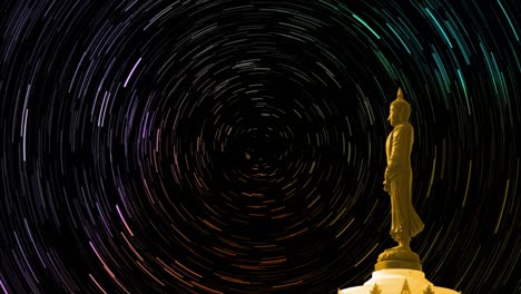 star trail hyper time lapse on the sky back buddha looking seven day style, focus to buddha and dolly moving