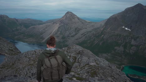 male backpacker exploring the salberget hill in norway - static shot