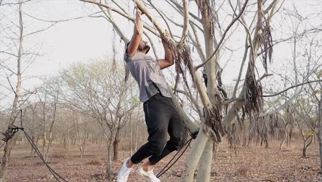 Young-Male-Athlete-Sports-Man-Training-Outdooors-Summer-Doing-Pull-Ups-Horizontal-Bar