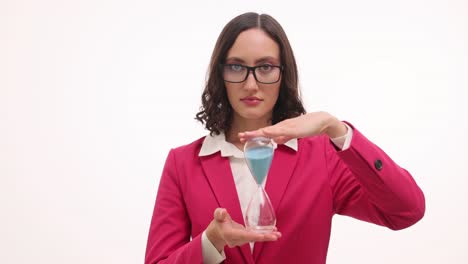 businesswoman holding an hourglass