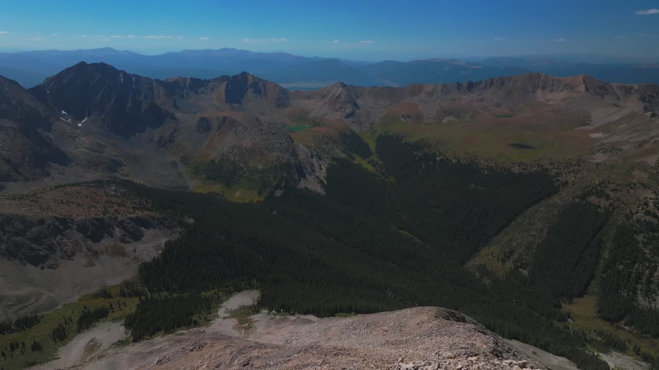 Collegiate Peaks Huron Peak summit 14er hike climb summer fall autumn Rocky Mountains Colorado drone aerial Three Apostles La Plata switchback Trail Buena Vista sunny blue sky snow forward over motion
