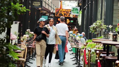 people walking and shopping in historic arcade