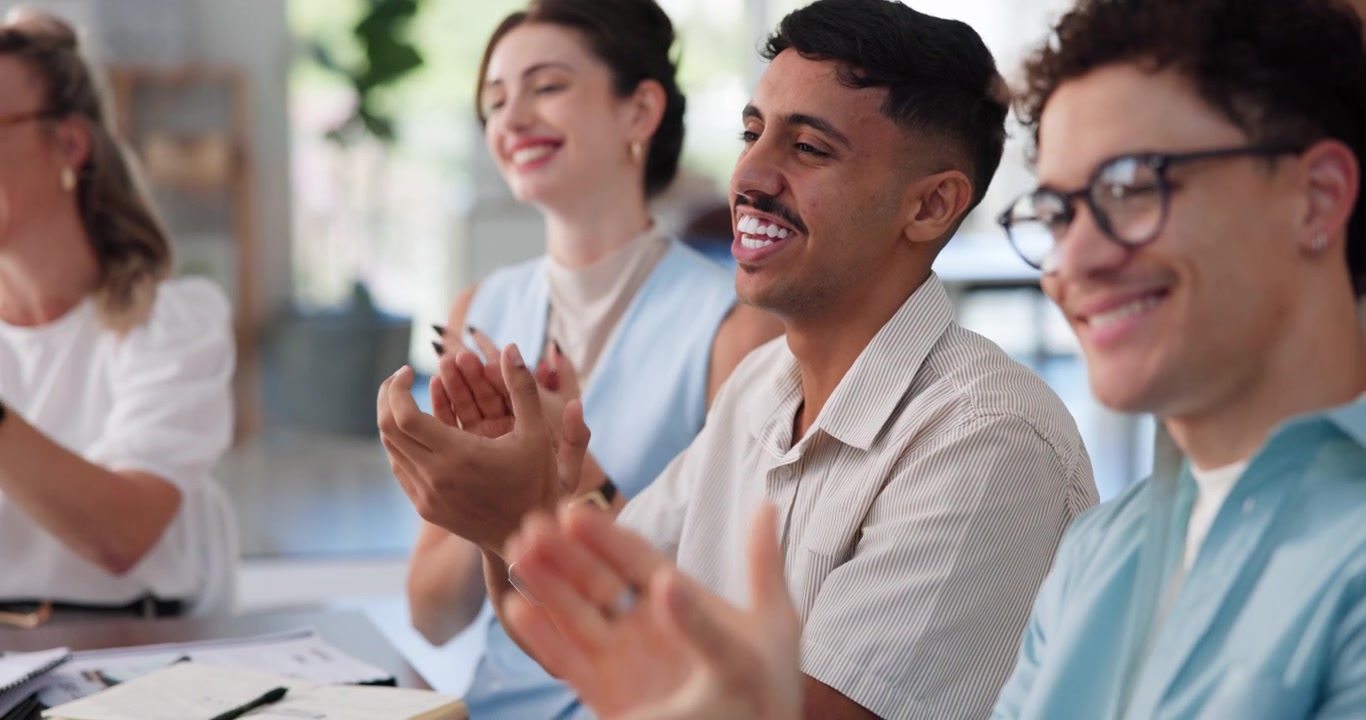 Diverse Group of Professionals Applauding During a Business Meeting