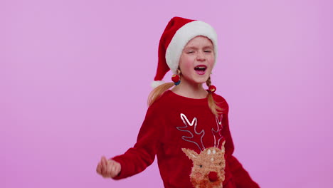 Girl-in-Christmas-Santa-sweater,-hat-dancing-trendy-dance-for-social-media-fooling-around-having-fun