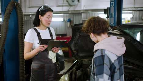 mechanic talking with client