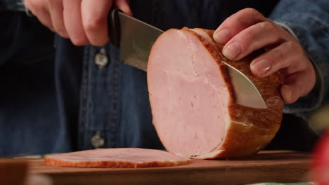 slicing a round of ham
