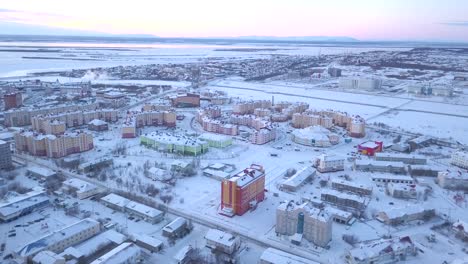 aerial view of a snowy city in winter