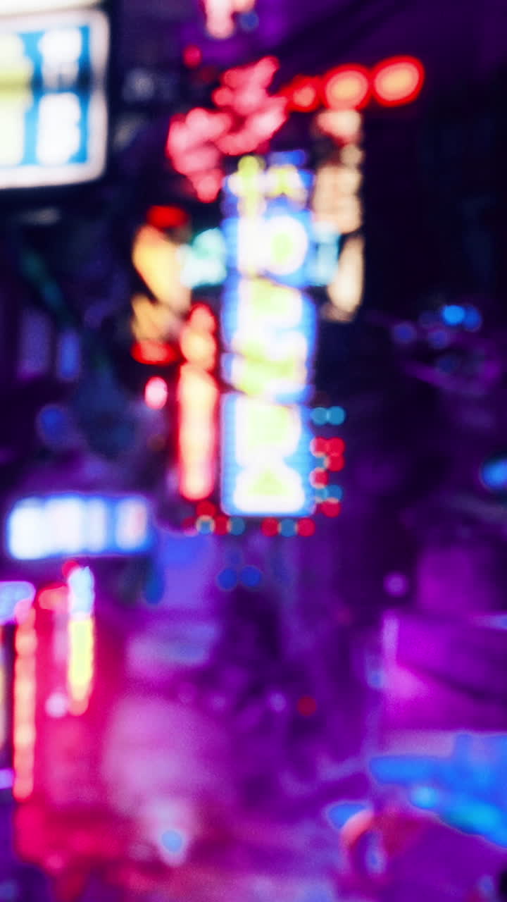 City streets with neon lights and blurred details at night in urban area