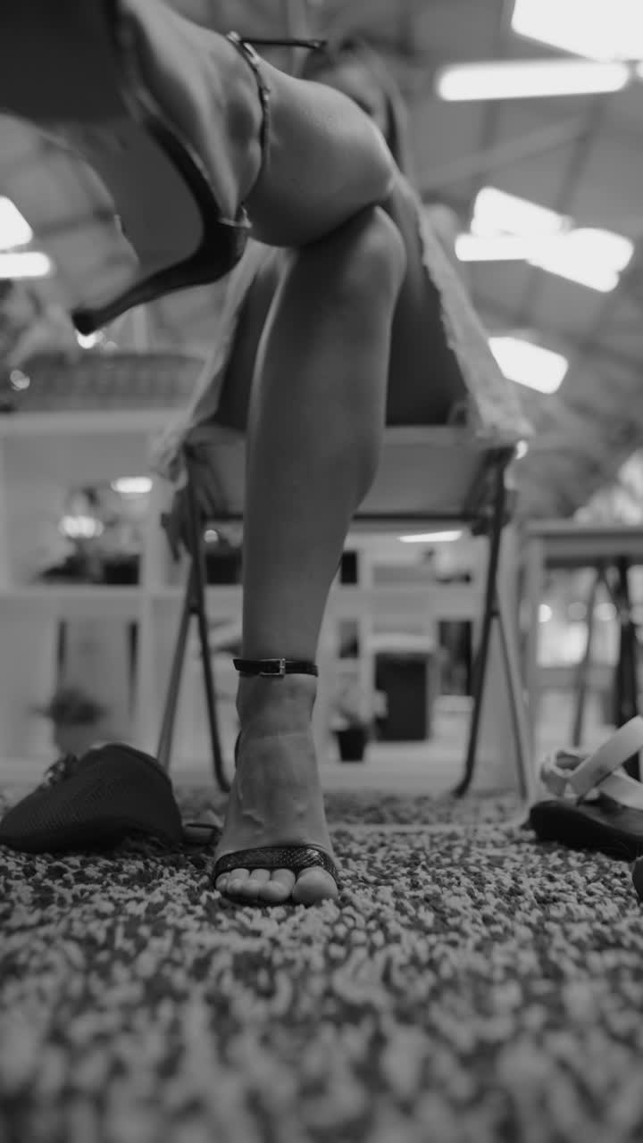 Woman sitting with sandals