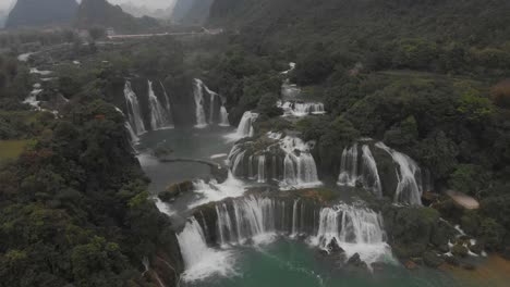 flying towards ban gioc waterfall at cao bang vietnam, aerial