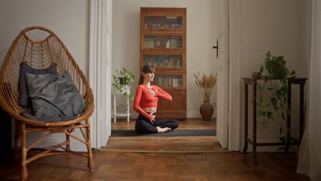 woman practicing yoga at home