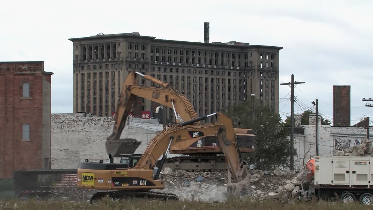 Rotten Michigan Central Station with baggers in front, Detroit, Michigan, USA