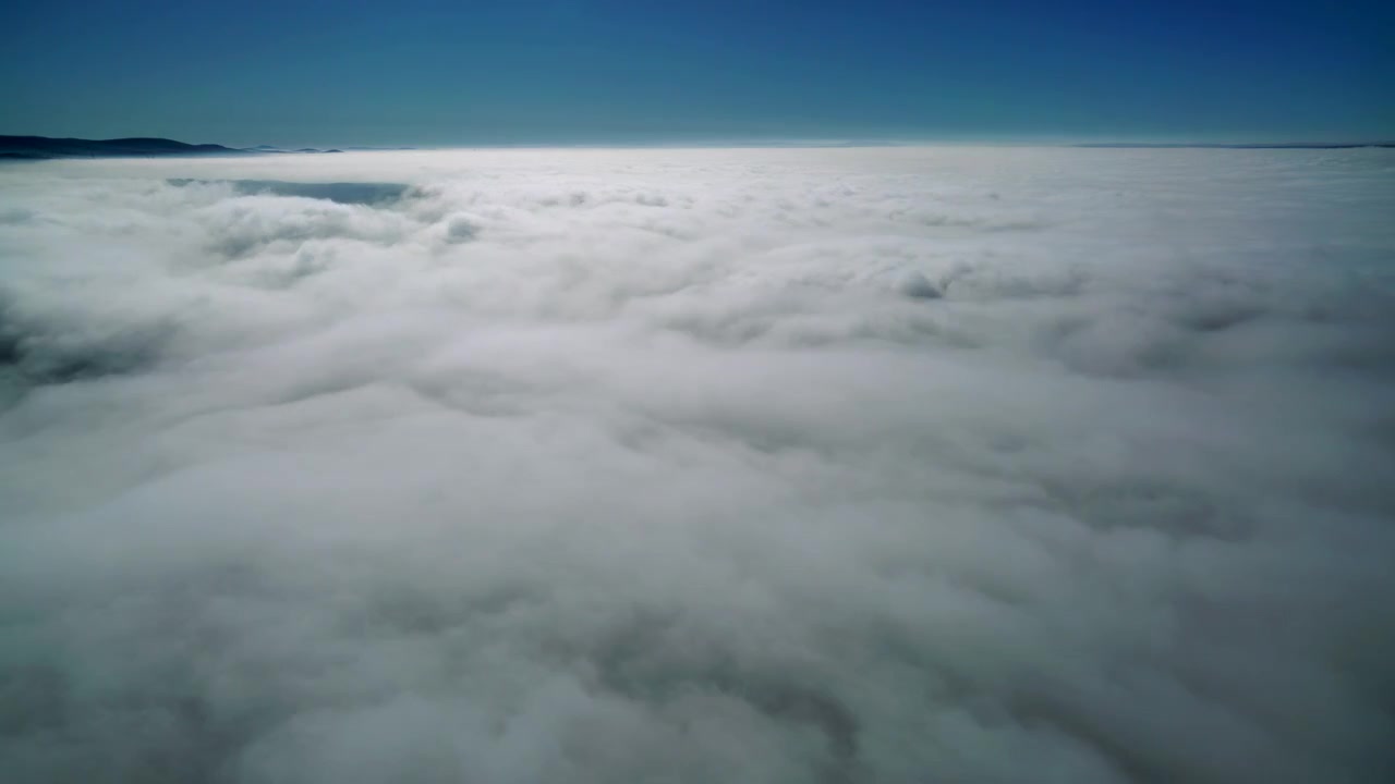 Aerial View of Thick White Clouds Covering the Landscape