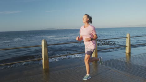 senior woman running on a promenade