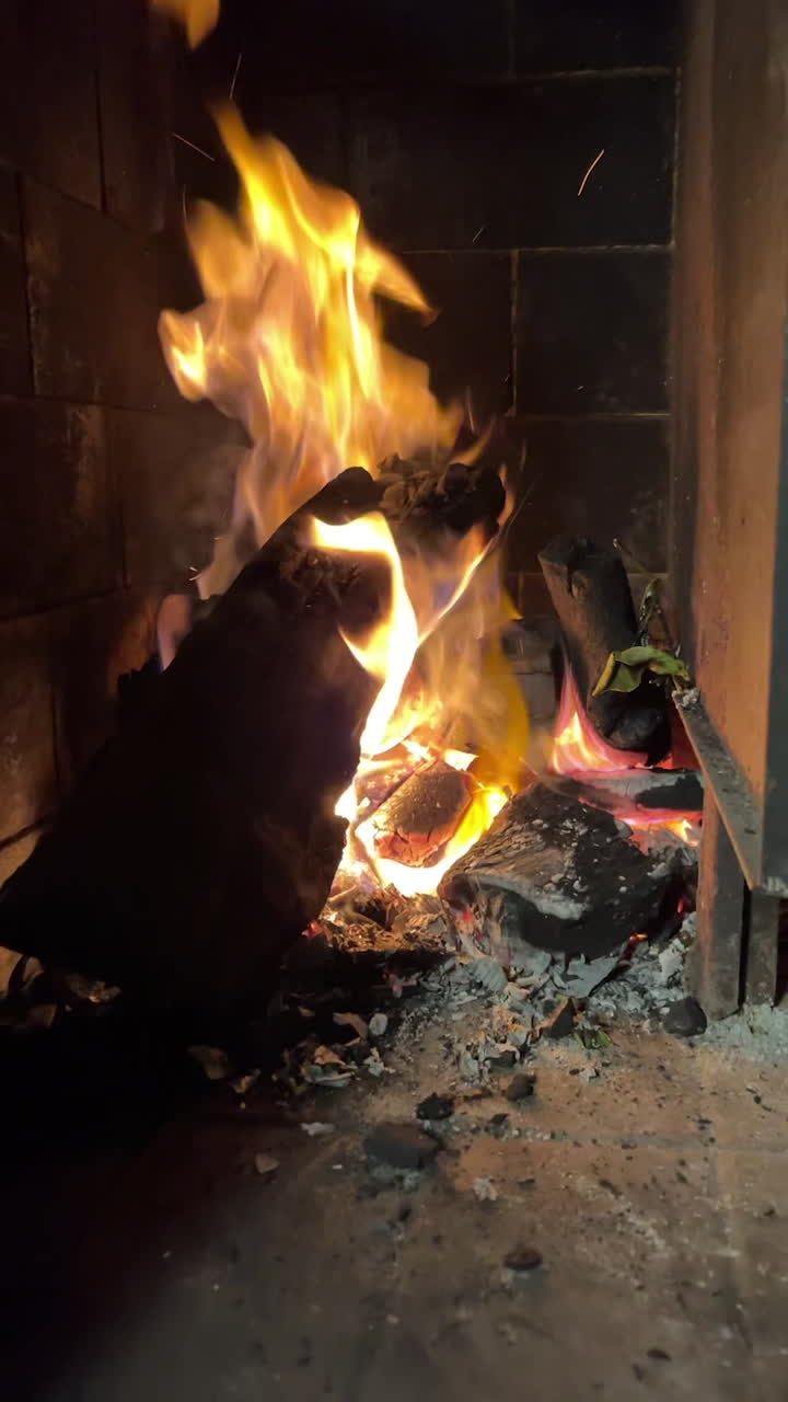 RED-HOT BURNING EMBERS ON AN ARGENTINE GRILL.