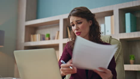 unhappy businesswoman negotiating video call in office. closeup upset employee