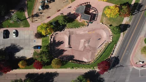 aerial view of people riding in a bike and skate park, in the fall