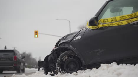 Crashed-car-with-caution-tape-on-the-side-of-the-road