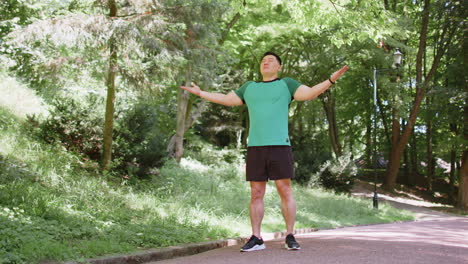 Sporty-Asian-man-practicing-yoga-meditation-receives-positive-energy-healthy-breath-exercises