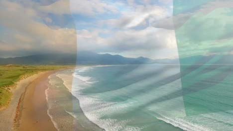 Digital-composition-of-ivory-coast-flag-waving-against-aerial-view-of-waves-in-the-sea