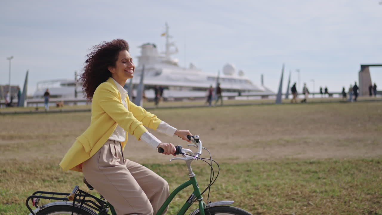 Woman riding bicycle in a city park