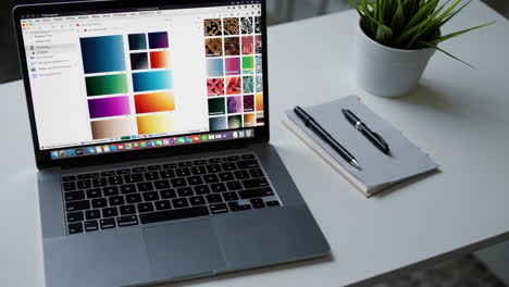 laptop with design software and workspace
