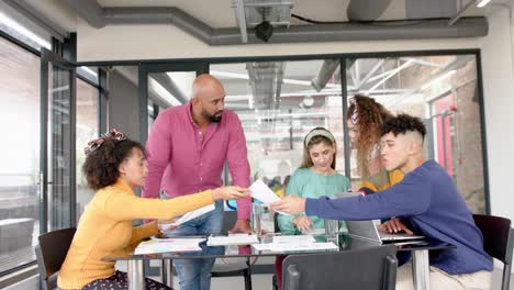 busy diverse business people discussing work at meeting in office in slow motion