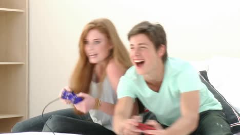 teenager couple playing a video game