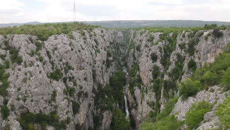 a beautiful view of the waterfall in the heart of nature