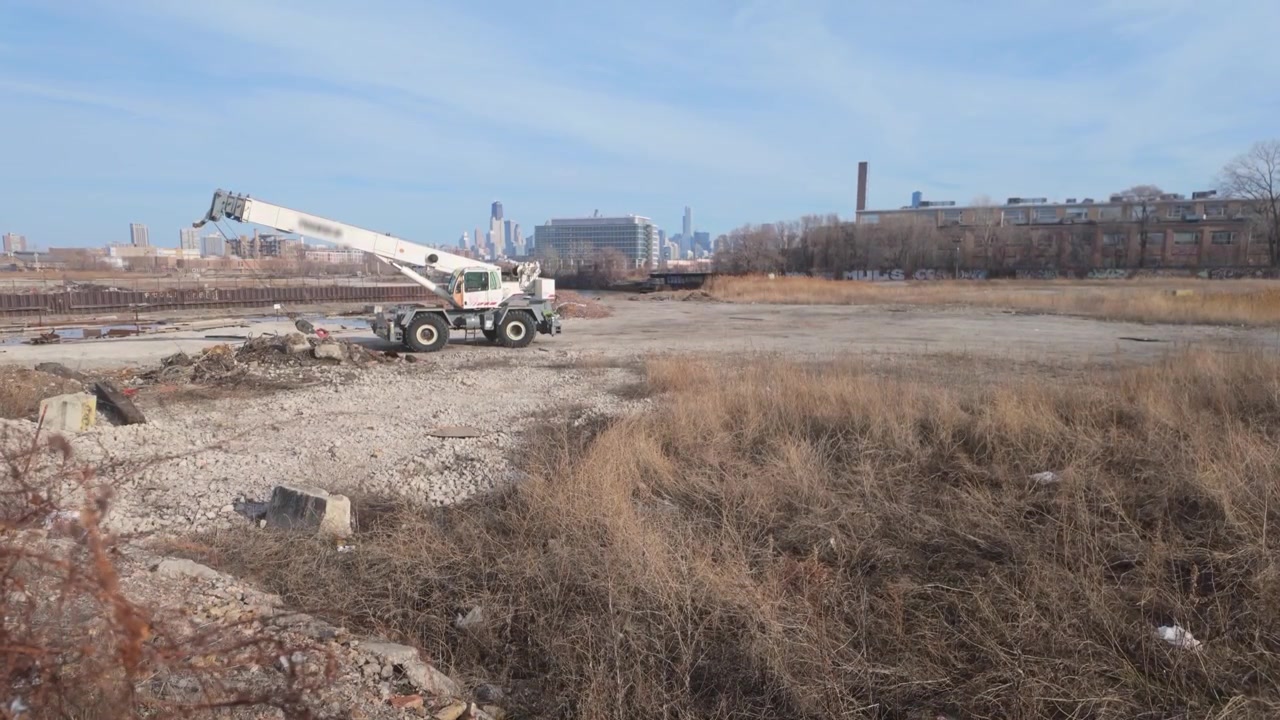 A construction site in Chicago with the skyline in the background.