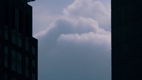 big heavy clouds between two skyscrapers - static shot