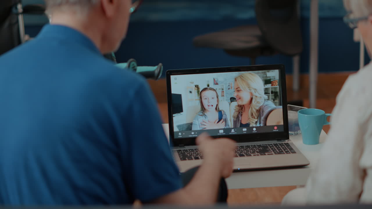 Elderly couple on video call with family