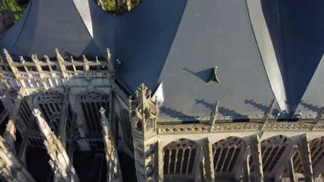 Aerial-shot-starting-from-an-amazing-cathedral-to-the-horizon-with-green-field-and-the-sky