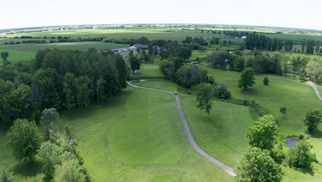 greens, fairways, cart paths and club house of golf course