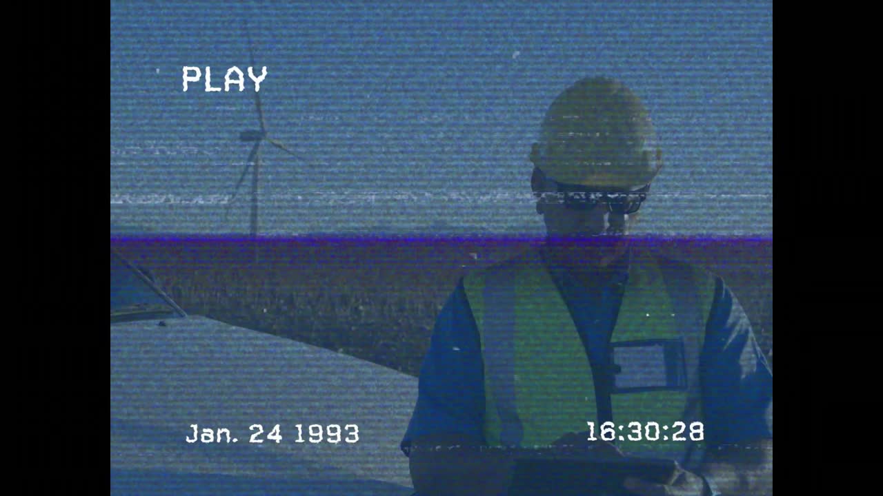 On arriving at vehicle technician collecting wind turbine data for monitoring with handheld device