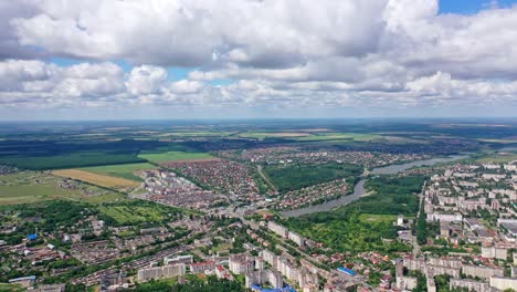 city landscape in summer. river flowing in the city. view from above on the city on the beautiful nature background. aerial view.