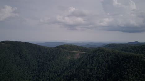 Aerial-hyperlapse-timelapse-zooming-out-from-mountainous-road-and-radio-tower-by-lover's-leap-in-Virginia