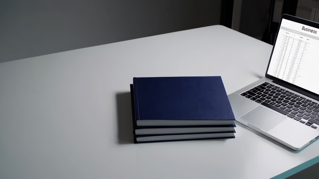 Modern Workspace with Laptop and Books