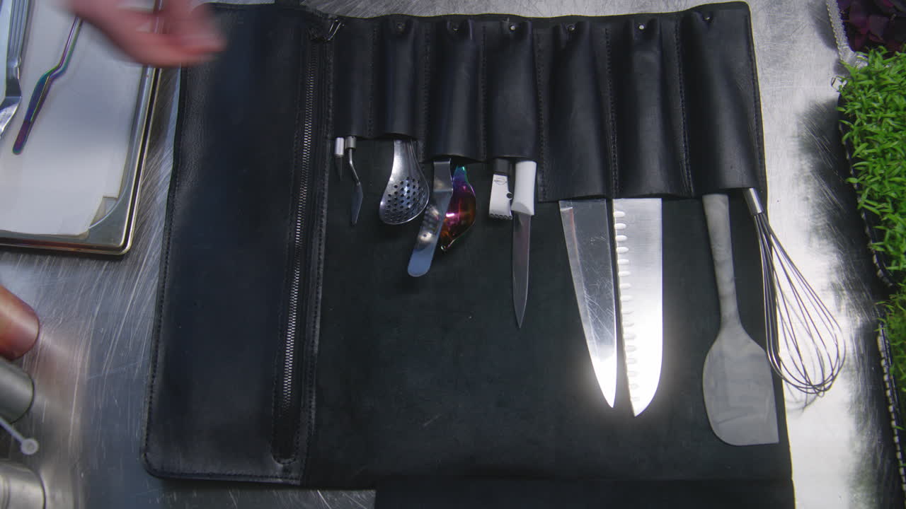 Chef Opens Rolling Knife Roll