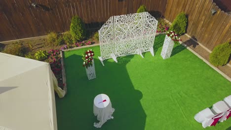 wedding venue with flowers and chairs at cottage aerial