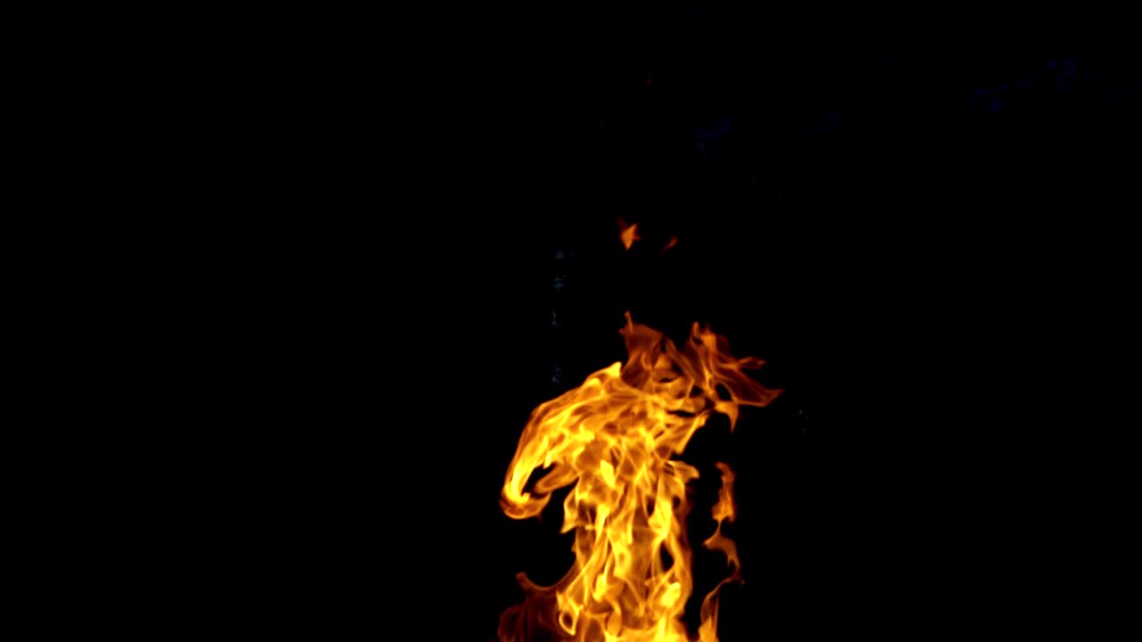 Fire flame on the black background. Fire in darkness. Slow motion